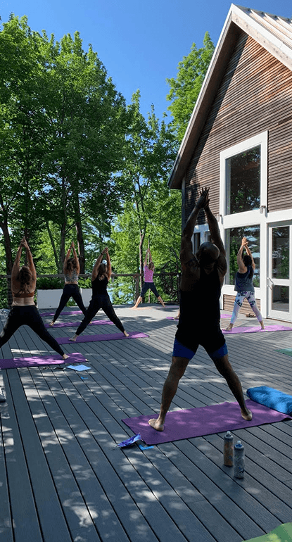 group-performing-yoga-outdoors-61d5be6d4734b